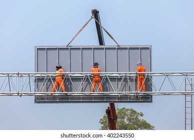 Workers Install Big Steel Billboard On Highway