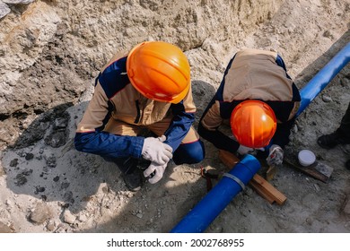 Workers are installing water supply pipeline system.