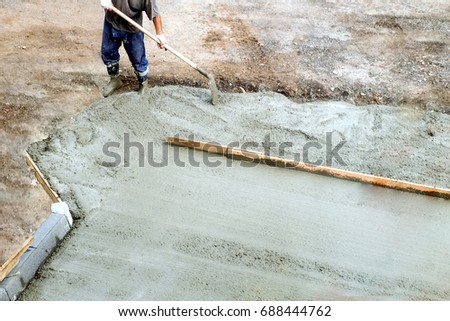 workers level road laying