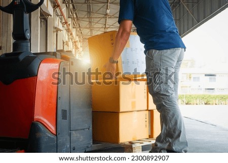 Workers Lifting Package Boxes Stacking on Pallet. Cartons, Cardboard Boxes. Supply Chain, Shipment Boxes, Shipping Supplies Warehouse Logistic.