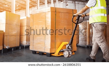 Workers Loading Bulk of Package Boxes in Warehouse. Forklift Pallet Jack Loader. Distribution Storage Warehouse. Supply Chain, Shipping Supplies Warehouse Logistics.		
