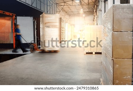 Workers Loading Pallets of Goods into A Truck Container. Loading Dock Warehouse at Night. Distribution Warehouse, Supply Chain, Supplies Shipment, Freight Truck Logistics, Cargo Transport.