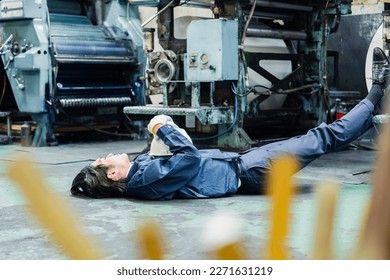 Workers lying down in the factory