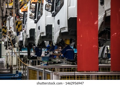 Workers In Machinery Factory In China.