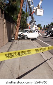 Workers In A Man Lift Aka Bucket Lift Prepare To Remove And Replace A 95 Foot Utility Pole Broken By A Car Accident