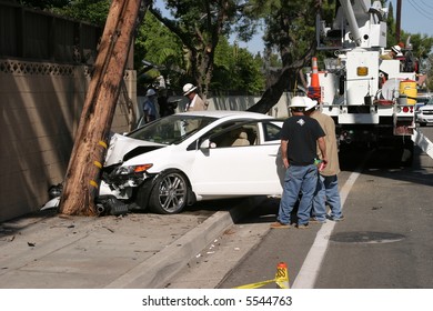 Workers In A Man Lift Aka Bucket Lift Prepare To Remove And Replace A 95 Foot Utility Pole Broken By A Car Accident