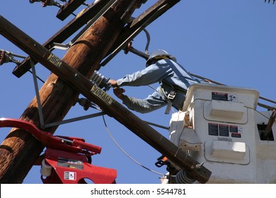 Workers In A Man Lift Aka Bucket Lift Prepare To Remove And Replace A 95 Foot Utility Pole Broken By A Car Accident