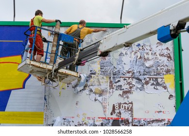 Workers On The Platform Install Advertising On A Billboard, Safety Engineering