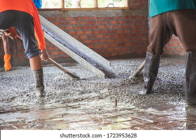 
Workers Pour Concrete In The Construction Site.