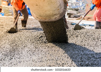 Workers Pouring Concrete Slab For Road Or Building.