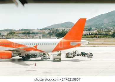 Workers preparing a plane for takeoff