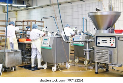 Workers In The Production Of Original German Bratwurst In A Large Meat Processing Plant In The Food Industry