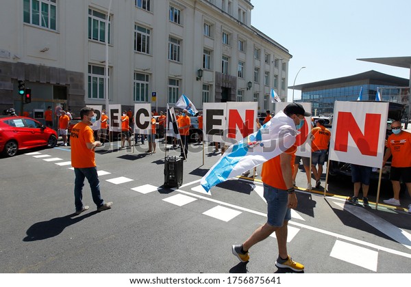 Coruña-Spain.\
Workers protesting with a mask due to the closure of Alcoa. Alcoa\
is a US aluminum company that will close its factory in A Coruña\
and fire its workers on May 28,\
2020.