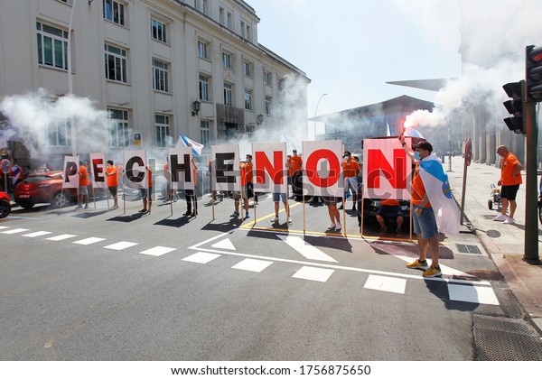 Coruña-Spain.\
Workers protesting with a mask due to the closure of Alcoa. Alcoa\
is a US aluminum company that will close its factory in A Coruña\
and fire its workers on May 28,\
2020.