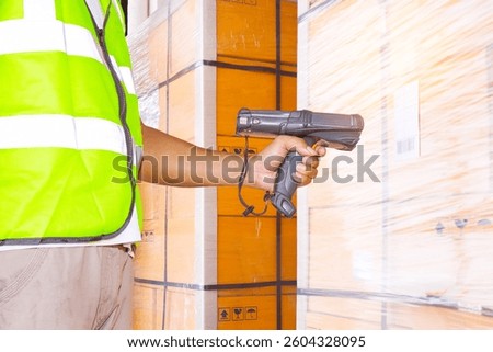 Workers Scanning Bar Code Scanner on Label. Computer Scanner Mobile Work Tools. Inventory Management. Delivery to Customers. Storehouse, Shipment Boxes, Shipping Warehouse Logistics.	
