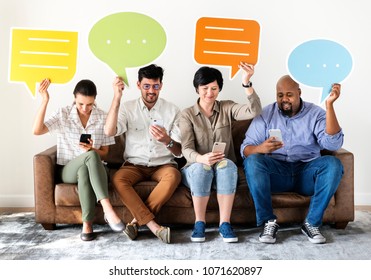 Workers sitting on couch and holding message boxes - Powered by Shutterstock