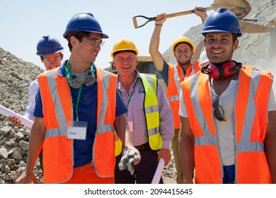 Workers smiling together in quarry - Powered by Shutterstock