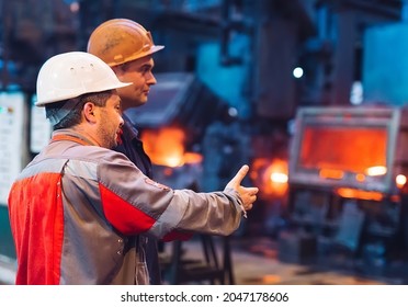 Workers in the steel mill. - Powered by Shutterstock