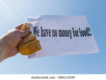 Workers' Strike For Non-payment Of Salaries Of Wages. A Worker Holds In His Hand A Piece Of Bread And A Banner, With The Message 