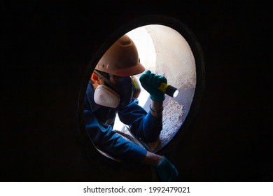 Workers take care safety of people working in confined spaces.