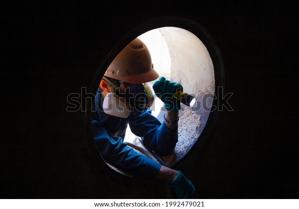 Workers take care safety of people working in\
confined spaces.