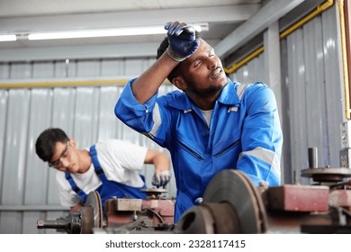 workers or technicians feeling tired from hot weather over heat in the factory
