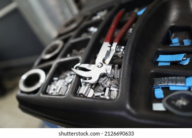 Workers tool kit full of instruments, metal nozzles, parts and equipment