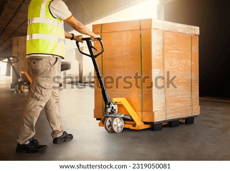 Workers Unloading Heavy Package Boxes into Container Truck. Forklift Pallet Jack Loader. Shipping Supplies. Supply Chain Shipment Goods. Distribution Warehouse Logistic