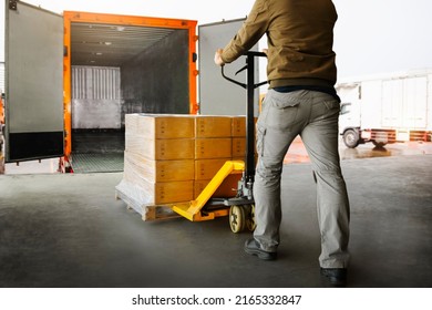Workers Unloading Packaging Boxes on Pallets into The Cargo Container Trucks. Loading Dock. Shipping Warehouse. Delivery. Shipment Goods. Supply Chain. Warehouse Logistics Cargo Transport.	
