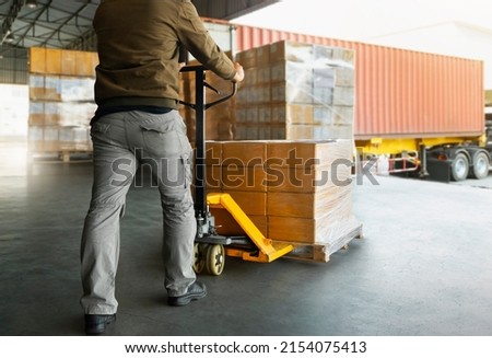 Workers Unloading Packaging Boxes on Pallets to The Cargo Container Trucks. Loading Dock. Shipping Warehouse. Delivery. Shipment Boxes. Supply Chain. Warehouse Logistics Cargo Transport.