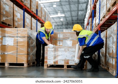 workers using Laser Barcode Scanner to checking stock items for shipping. male and female inspecting the store factory. industry factory warehouse. Logistics employees working at warehouse management. - Powered by Shutterstock