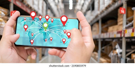 Workers using smartphone cargo freight loading and tracking delivery with a mobile phone, transportation and global network of smart logistics, import-export