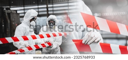 Workers wear protection suit checking chemical contaminated oil in old factory. Red and White Lines Marking a Dangerous Zone. Biohazard Contamination Control.