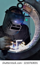 Workers Wearing Masks Are Welding Meticulously