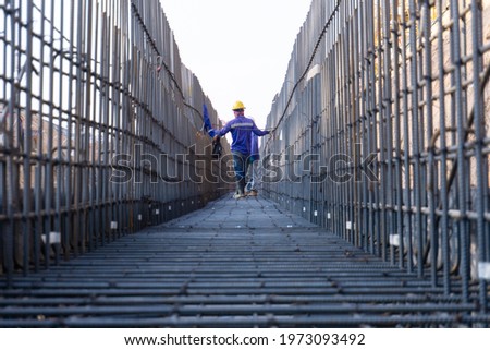 workers are working rebar work at a construction site