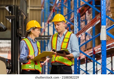 Workers working in warehouse, Manager and supervisor taking inventory in warehouse, Female foreperson making plans with warehousemen - Powered by Shutterstock