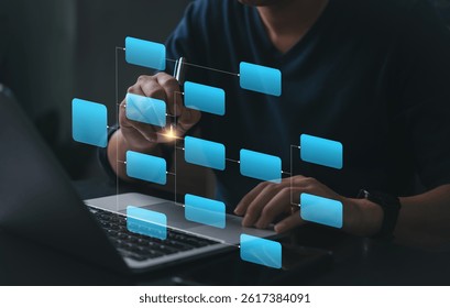 Workflow diagram overlay on laptop screen. Business process mapping and data structure visualization. Man working with digital flowchart interface. Smart planning, project task management