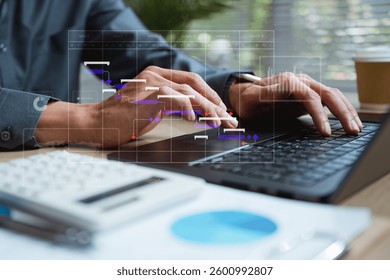 Workflow process solution plan management. Flowchart implement strategy interface diagram. A man is typing on a laptop with a calendar on the screen. He is using a calculator and a pen on the desk.