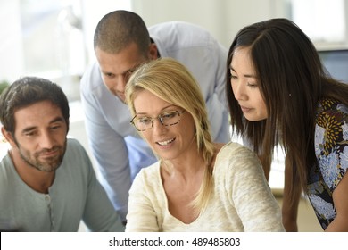 Workgroup In Office Meeting On Project