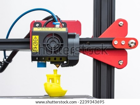 Working 3d printer. Printhead with hotend and fan close-up. Isolated on white background
