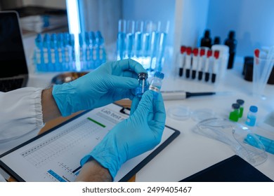 working atmosphere in the laboratory, chemistry and science specialist working in a lab with various experimental equipment and substances, experimental professional working in the lab - Powered by Shutterstock