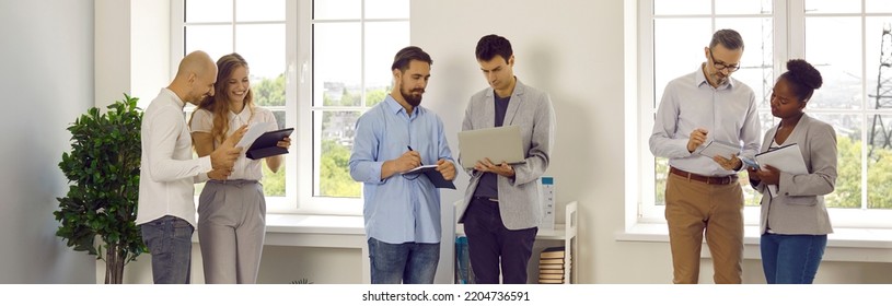 Working atmosphere in office. Three teams of office workers colleagues are talking, discussing and solving work issues during routine office life. Concept of business people. Panoramic web banner. - Shutterstock ID 2204736591