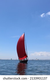 Working Boat With Red Sail Racing In The Carrick Roads Cornwall