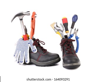 Working boots with some different tools. Close up