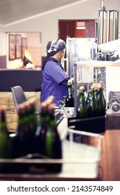 Working At The Bottling Plant. Shot Of A Worker In A Wine Bottling Plant.