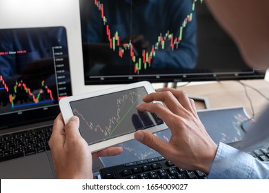 Working Business Man, Team Of Broker Or Traders Talking About Forex On Multiple Computer Screens Of Stock Market Invest Trading Financial Graph Charts Data Analysis