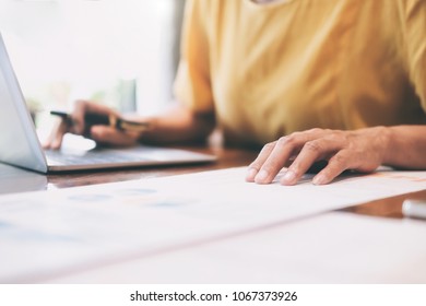 Working business people analyse high performance marketing data. - Shutterstock ID 1067373926