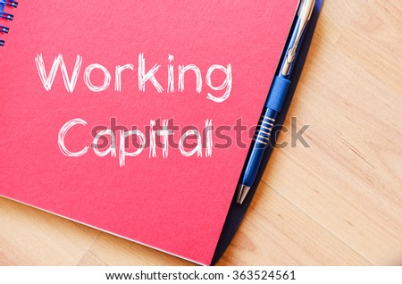 Working capital text concept write on notebook with pen