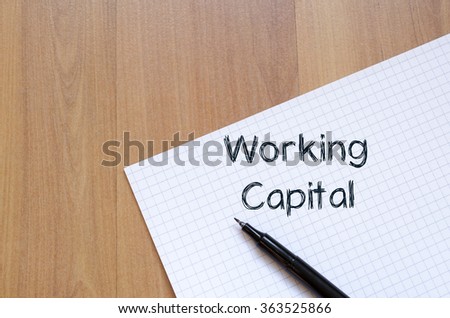 Working capital text concept write on notebook with pen