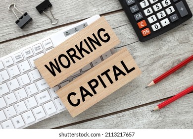 Working Capital Wooden Blocks On White Keyboard